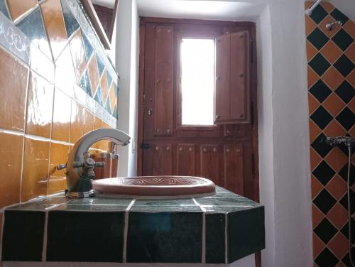 a bathroom with a sink with a faucet at Villa Aguacate in Nerja