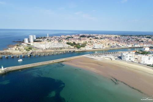 an aerial view of a beach and a city at La Maison du pêcheur - Jacuzzi 3 Etoiles in Jard-sur-Mer