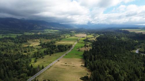 an aerial view of a road in a field with trees at Pillow House Montibus in Pribylina
