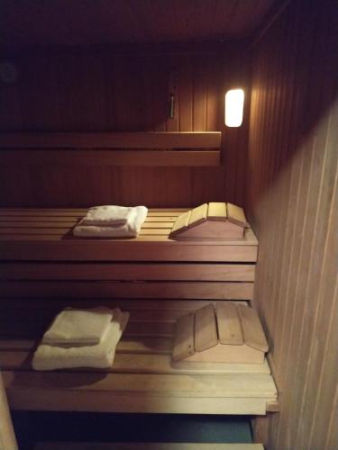a room with three bunk beds with white towels at Apartmenthaus Kestel Gasthof in Kirchbach