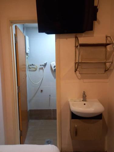 a bathroom with a sink and a shower at Golden Leaf Hotel Danga Bay in Johor Bahru