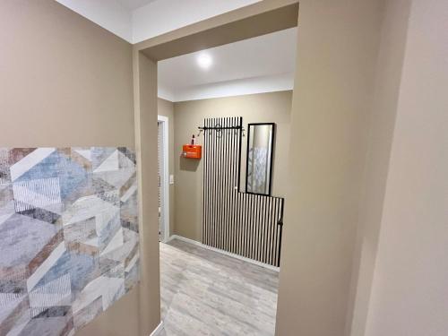 a hallway of a home with a painting on the wall at Dilmac Apartments in Herford