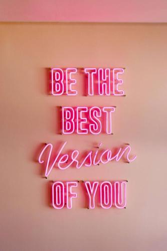 a neon sign that says be the best version of you at The Quarter Ratchathewi by UHG in Bangkok