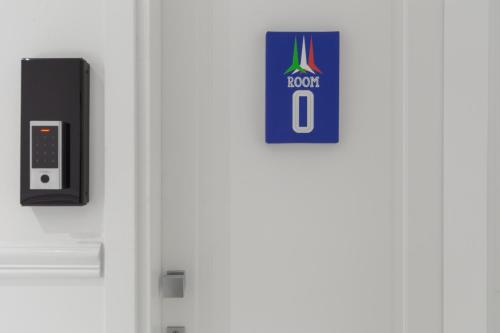 a door with a room sign on it at Leia Hospitality in Milan