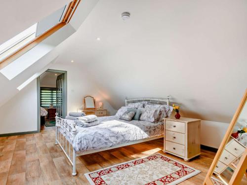 a bedroom with a bed and a wooden floor at 2 Bed in Hailsham 89416 in Hailsham