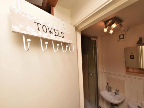 a bathroom with a sink and a toilet at 1 Bed in Appledore MASTR in Appledore