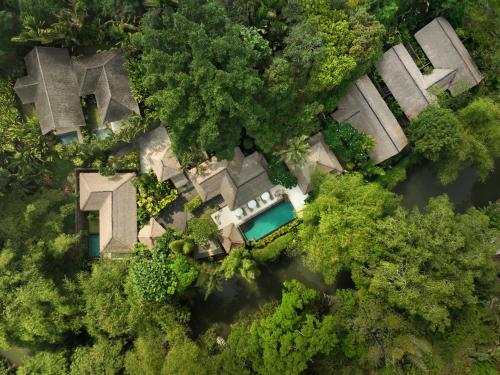 an aerial view of a house in the middle of a river at OMECURE Kaba Kaba by Nakula in Tabanan