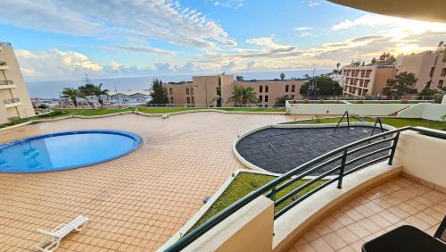 a view from the balcony of a apartment with a swimming pool at CRISTO REI APARTMENT in Caniço