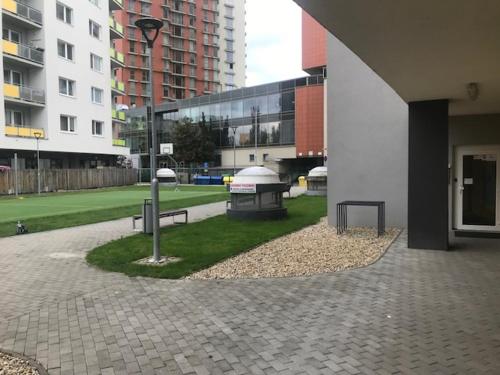 a courtyard with two benches in a building at Foreta in Bratislava
