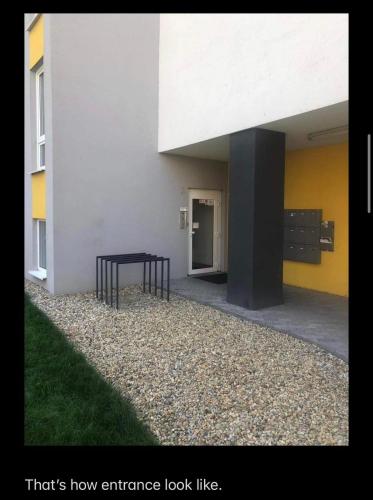 an entrance to a building with a table next to it at Foreta in Bratislava
