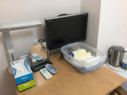 TV o dispositivi per l'intrattenimento presso Business Inn Grandeur Fuchu