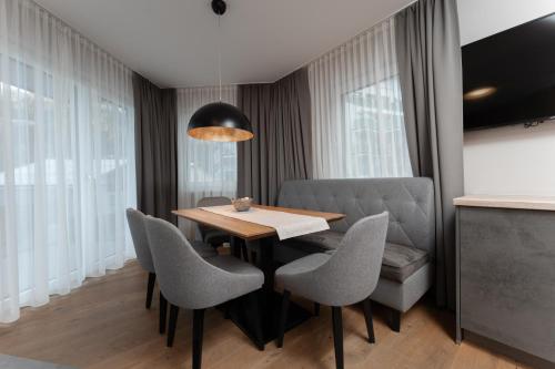 a dining room with a table and chairs at A Casa Elements in Serfaus