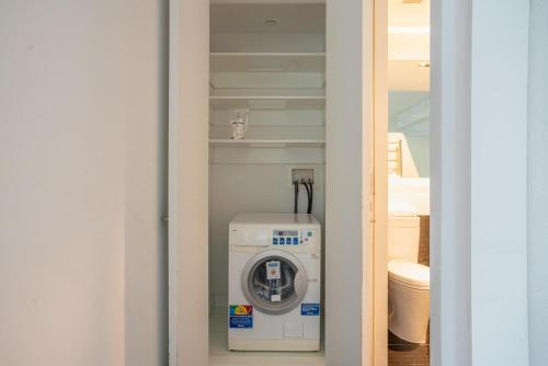 a washer and dryer sitting inside of a closet at Financial District 1br w WD gym elevator NYC-1370 in New York