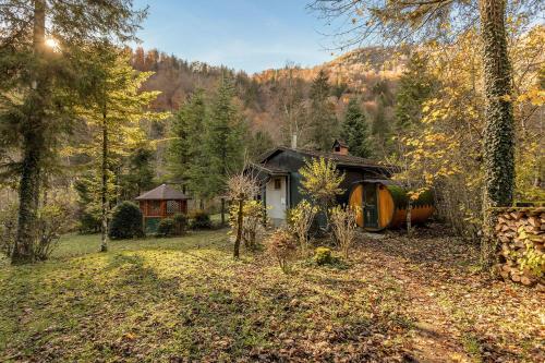 a cabin in the middle of a forest at Cabin by the river Polhov Gradec in Polhov Gradec