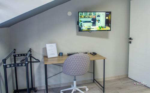 TV a/nebo společenská místnost v ubytování Maxim Apartments