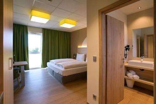 Mainfranken Motel - Anreise rund um die Uhr - Neueröffnung 2023にあるベッド