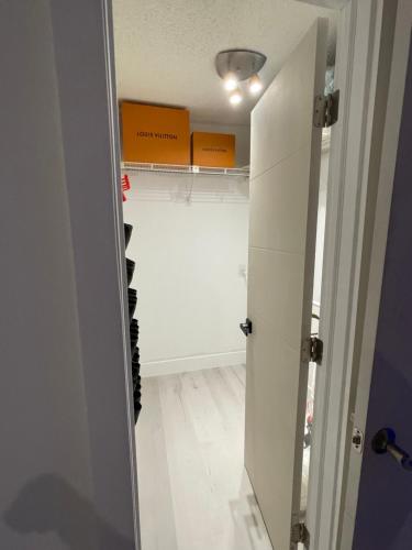a hallway with a closet with wine bottles in it at Pinto luxury Village in Hallandale Beach
