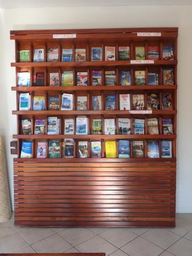 a book shelf filled with lots of books at Bluewater Lodge in Nadi