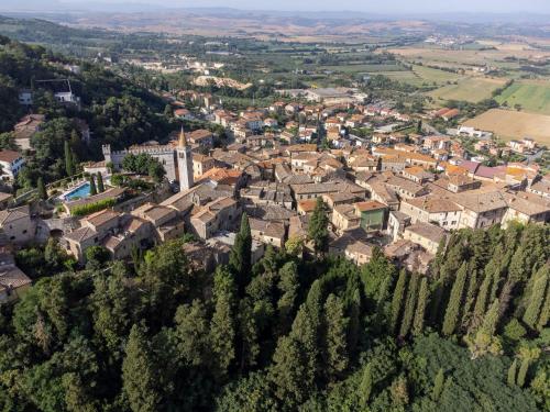 an aerial view of a small town in a city at Torre Di Serre by PosarelliVillas in Serre di Rapolano