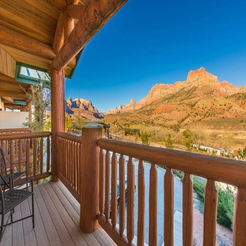 a wooden deck with a view of a mountain at Hotel De Novo Springdale, Tapestry Collection by Hilton in Springdale