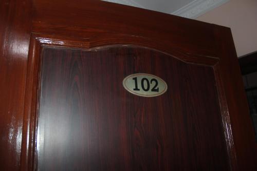 a wooden door with the number on it at Hotel Happy Home or Mudkhu Durbar in Kathmandu