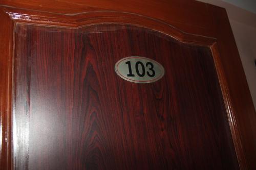 a wooden door with the number on it at Hotel Happy Home or Mudkhu Durbar in Kathmandu