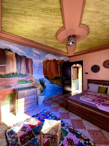 1 dormitorio con un mural de cascada en la pared en Double Room Private - Sea View en Tamraght Ouzdar