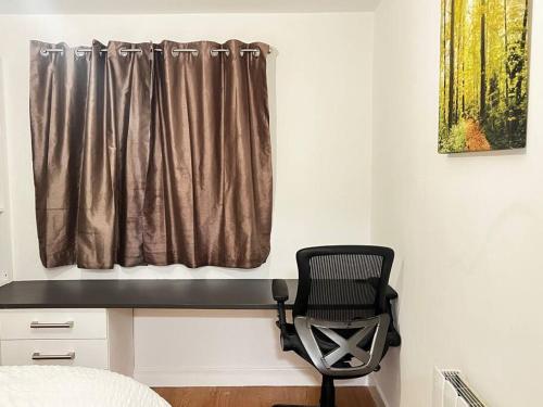 a bedroom with a desk and a chair next to a window at Relax in this cosy Haven near Glenfield and Royal Infirmary Hospitals in Leicester