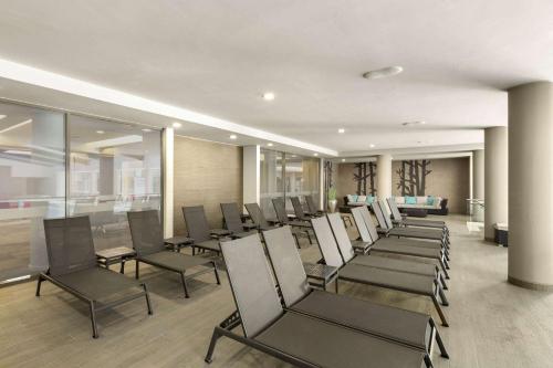 a row of chairs in a waiting room at Ramada Plaza by Wyndham Bucharest Convention Center in Bucharest