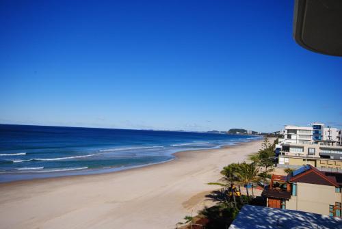 a view of a beach with buildings and the ocean at Albatross North Apartments in Gold Coast
