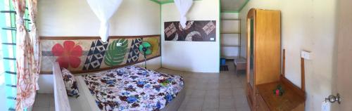 a room with a bed in the corner of a room at Waya Lailai Eco Haven in Wayasewa Island