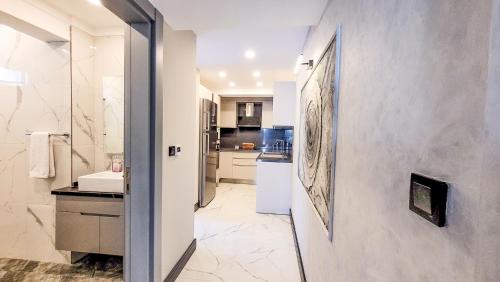 a bathroom with a sink and a counter at Yalikavak Twin Villa in Bodrum City