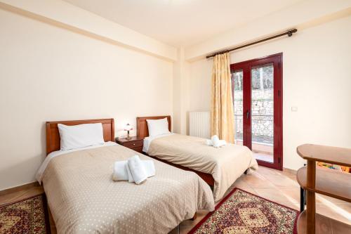 Tempat tidur dalam kamar di Το Πέτρινο