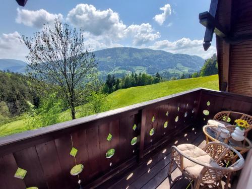 a balcony with a view of the mountains at Sunflower House with SPA and Sauna in Vitanje