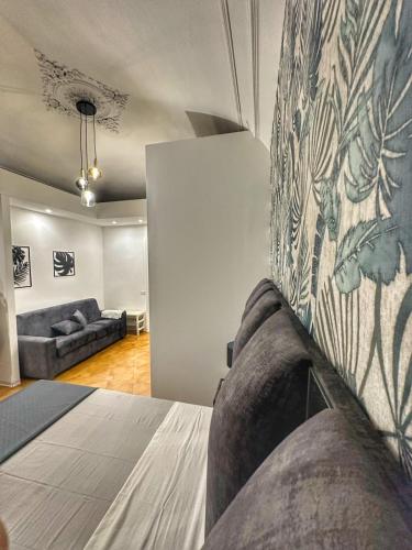 a living room with a bed and a couch at Boutique Rooms B&B in Catania