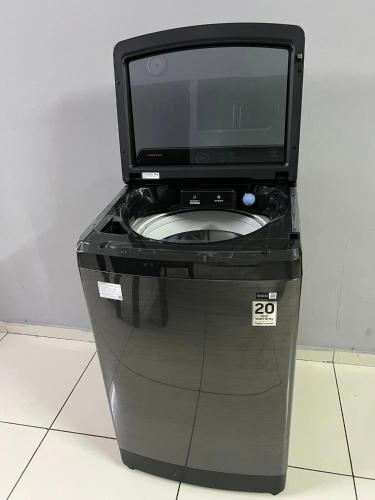 a computer monitor sitting on top of a trash can at TRMOTEL in Matola