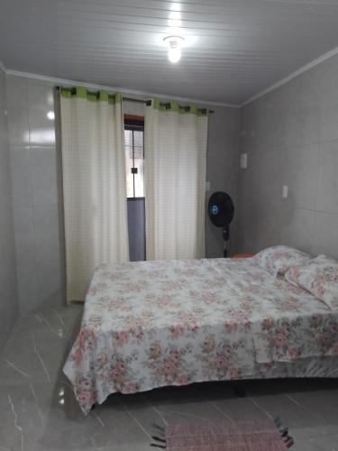 Cama o camas de una habitación en Acomodação com frigobar,wifi,Tv