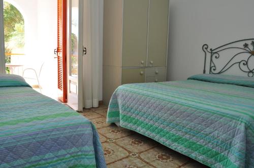 Ένα ή περισσότερα κρεβάτια σε δωμάτιο στο Hotel Polito
