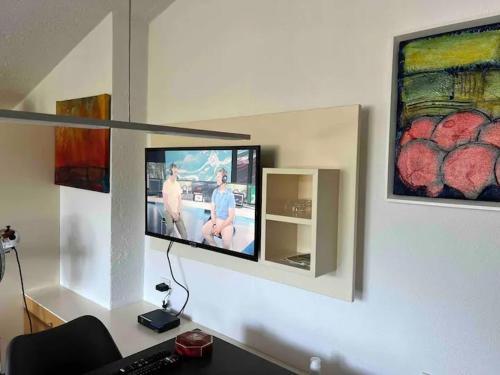 a tv on a wall in a room at Lake view appartment in Zell-am-See city centre in Zell am See