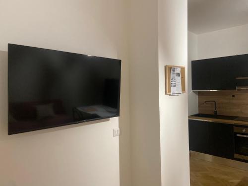 a large flat screen tv hanging on a wall at Casa Lalli in Lecce