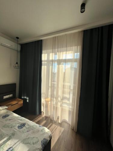 Postel nebo postele na pokoji v ubytování Центр &VIP Apartment & ЖК Театральний & ЖК Шевченка Парковка