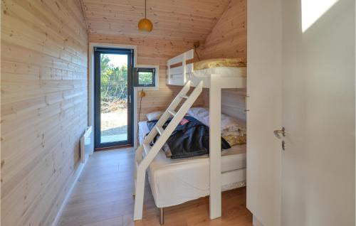 a bedroom with a bunk bed in a tiny house at 3 Bedroom Lovely Home In Anholt in Anholt
