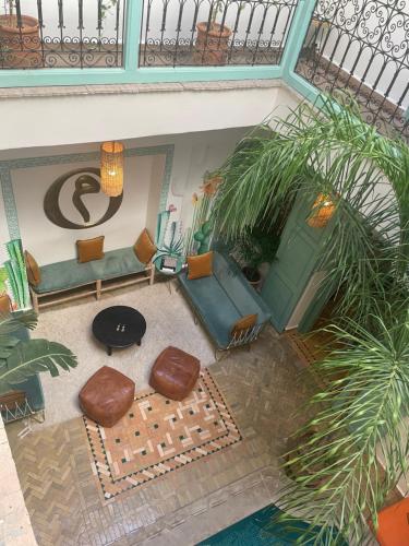 an overhead view of a living room with chairs and a table at Riad Gasämbre Touareg in Marrakech