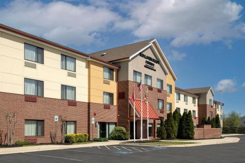 a rendering of the front of a hotel at TownePlace Suites by Marriott Lexington Park Patuxent River Naval Air Station in Lexington Park