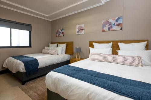 Postel nebo postele na pokoji v ubytování Luxury 303 Marina Bay Apartment