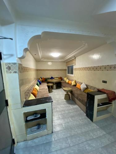 a room with a couch and tables in a room at Dar El Yacout in Rabat
