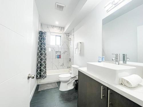 a bathroom with a sink and a toilet and a shower at 4BR L.A. Dream Home -CL1 in Los Angeles
