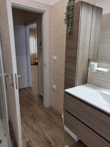a bathroom with a sink and a mirror at la casa di Carla in Pescara