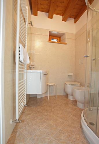 a bathroom with a sink and a toilet at Albergo Diffuso Polcenigo C. Zoldan in Polcenigo