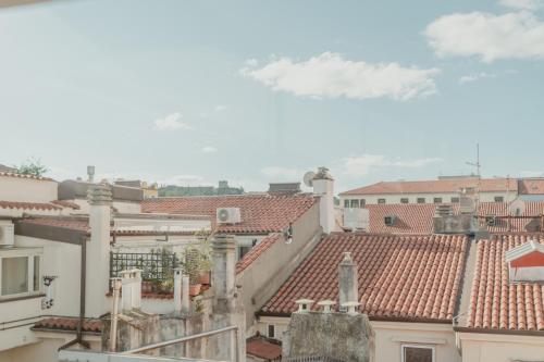 a view of roofs of buildings in a city at Aphrodite Luxury APT with Jacuzzi in Trieste